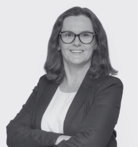 Black and White Headshot of Carolyn Antoni. Arms crossed