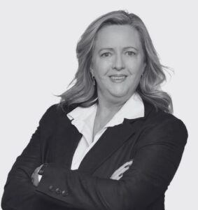 Black and White Headshot of Denise Arlidge. Arms crossed