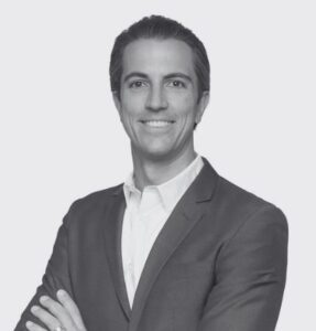 Black and White Headshot of Joshua De Buelle Arms crossed